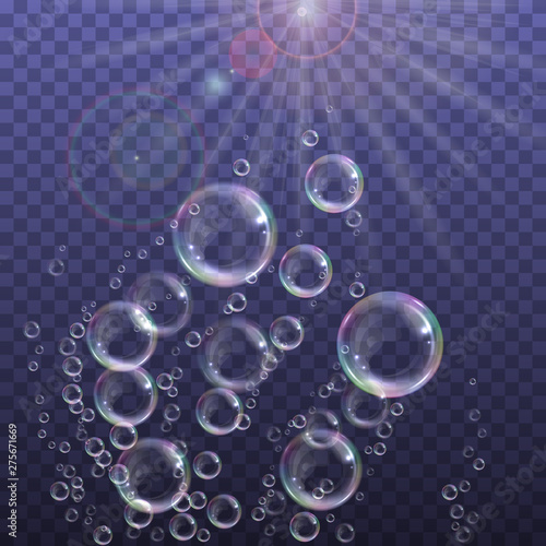 Realistic floating soap bubbles with rainbow reflection on transparent background. Design element for advertising booklet, flyer or poster