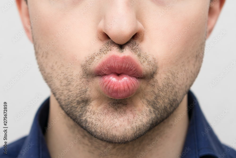 Obraz premium Beautiful bearded man sending air kiss, closeup