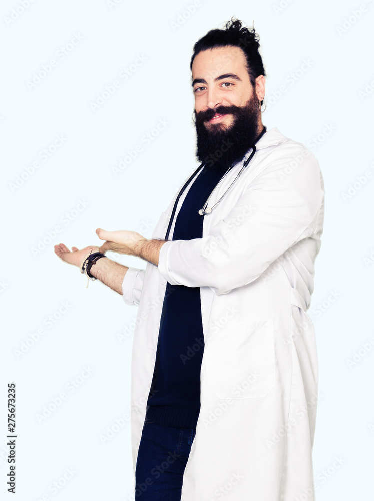 Doctor with long hair wearing medical coat and stethoscope Inviting to enter smiling natural with open hand Doctor with long hair wearing medical coat and stethoscope Inviting to enter smiling natural with open hand