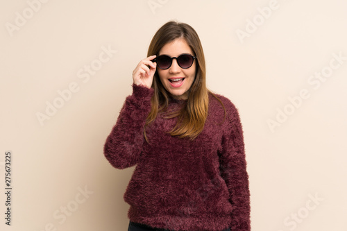 Young girl with glasses and surprised