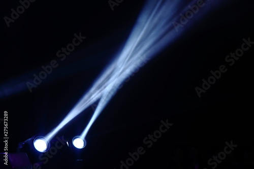 projector spotlights in smoke texture . lights beam for showing presentation . production and director multimedia background .