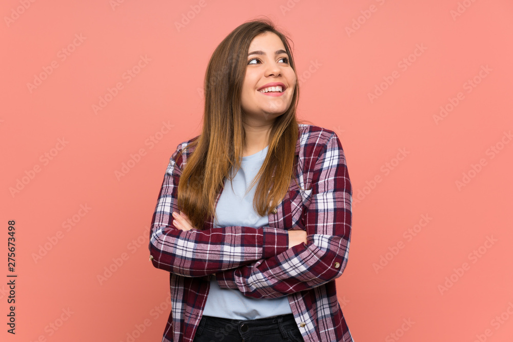 Young girl over pink wall happy and smiling Young girl over pink wall happy and smiling