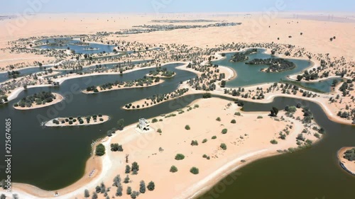 Drone shot of Al Marmoom Desert Conservation Reserve or Al Qudra man made lakes in Emirate Of Dubai, UAE photo