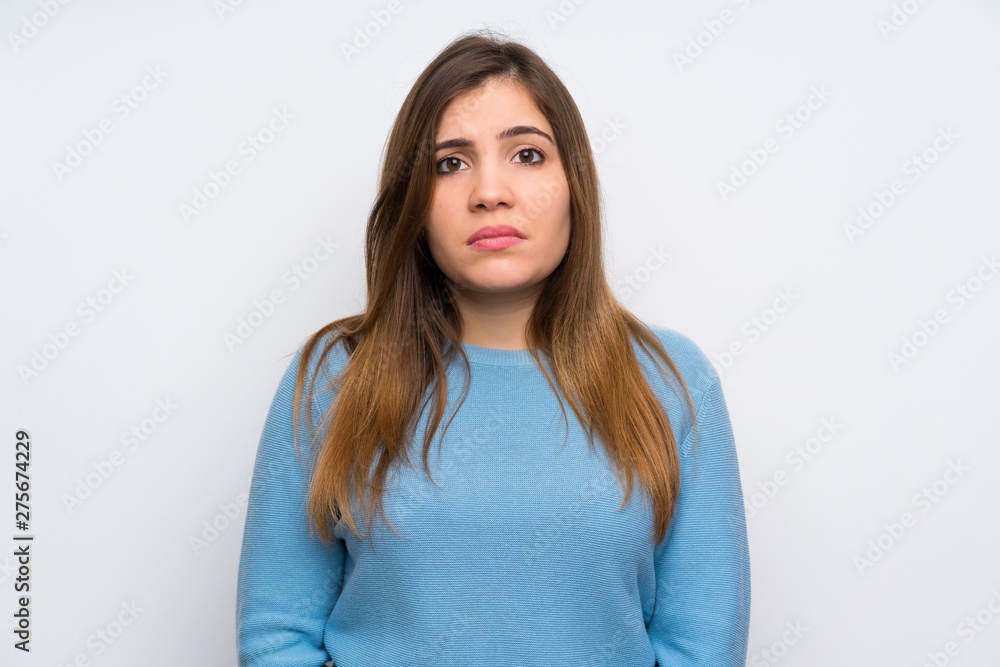 Young girl with blue sweater sad Young girl with blue sweater sad