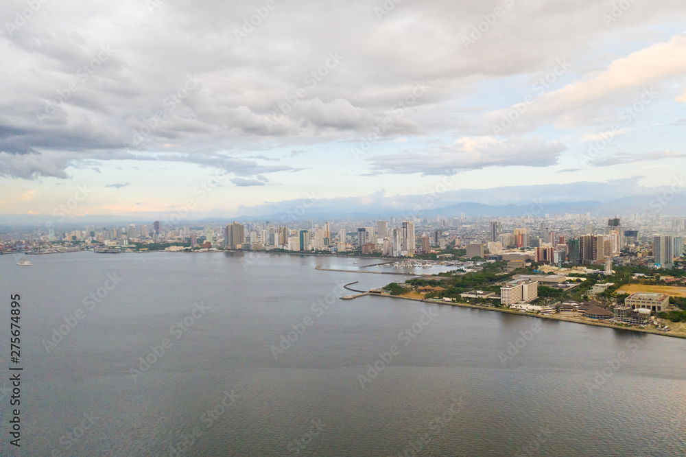 Manila city in the morning, view from above. Panorama of a large port city. City with modern buildings and skyscrapers. Manila, the capital of the Philippines. Asian metropolis.
