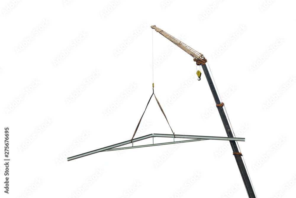 The crane is lifting the steel roof structure on a white background. The crane is lifting the steel roof structure on a white background.