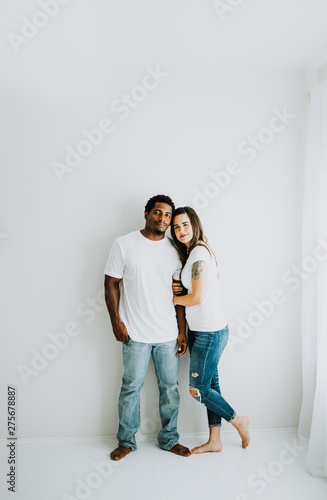 Happy Biracial Couple in Modern White Room © MeganBetteridge