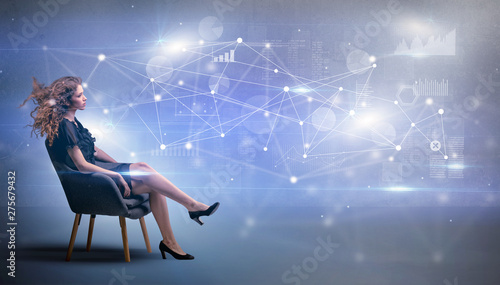 Elegant woman sitting in a sofa with network and connection concept 