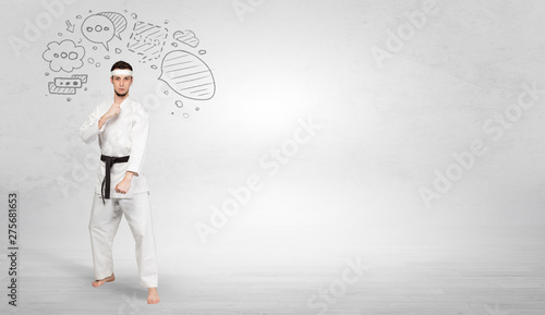 Young kung-fu trainer fighting with doodled symbols concept 
