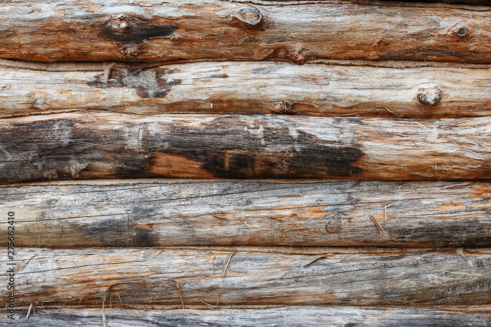 Log cabin wooden facade texture or rustic wood horizontal background. Full screen Log cabin wooden facade texture or rustic wood horizontal background. Full screen