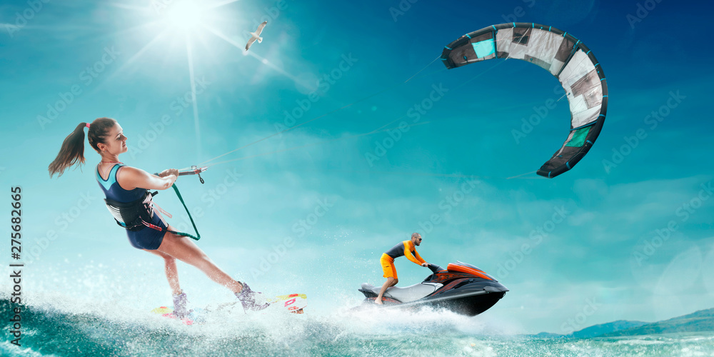 Kite surfing and water scooter in tropical ocean. Kite surfing and water scooter in tropical ocean.