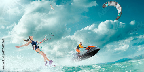 Photography Kite surfing and water scooter in tropical ocean.