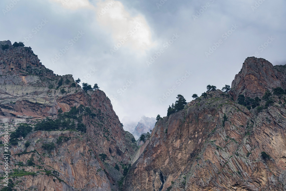 Landscape with foggy rocky mountains of North Caucasus