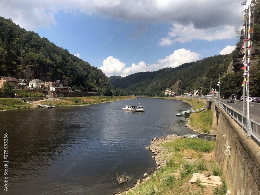 Elbe River in the Bohemian Switzerland National Park with ferryboat connects the Czech Republic and Germany, Hrensko, Czech Republic.