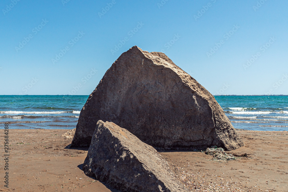 Huge boulder on the sea beach