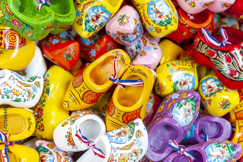 Traditional Dutch souvenirs for sale, wooden colorful souvenir clogs in gift shop in Amsterdam, Netherlands