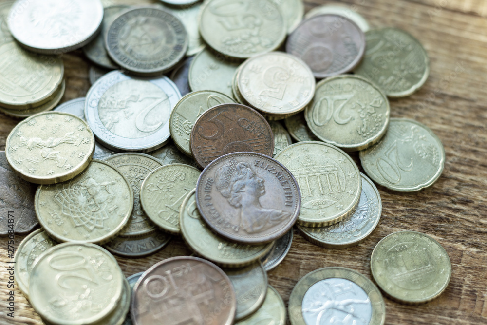 coins old rusty brass euro Seychelles Bulgaria China Germany pile pack heap stack on a wooden background finance economy investment savings concept mock up selective focus close up coins old rusty brass euro Seychelles Bulgaria China Germany pile pack heap stack on a wooden background finance economy investment savings concept mock up selective focus close up
