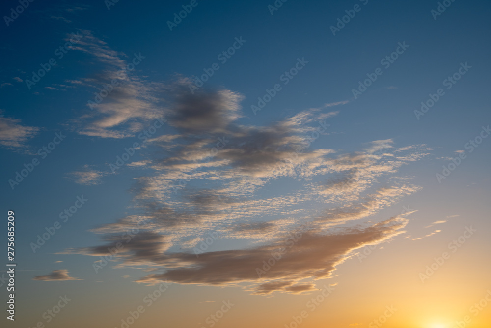 Obraz premium Cloudscape with light clouds against a sunset sky background, Italy