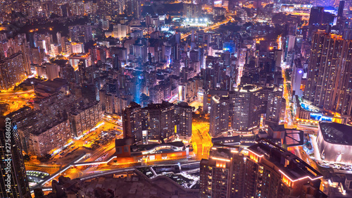 High view of Hong Kong skyline cityscape night light with traffic light in the road, expressway and intersection with skyscrapers at downtown