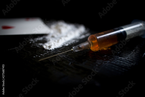 Drug abuse dangerous drugs cocaine heroin heroine addiction concept black background 