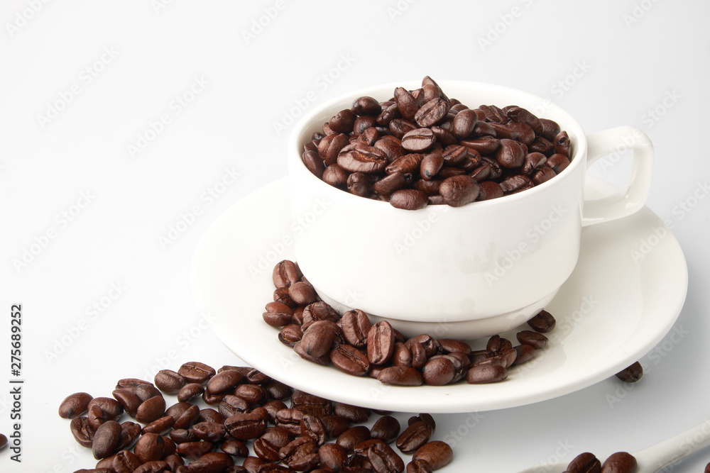 aromatic roasted coffee beans on white background