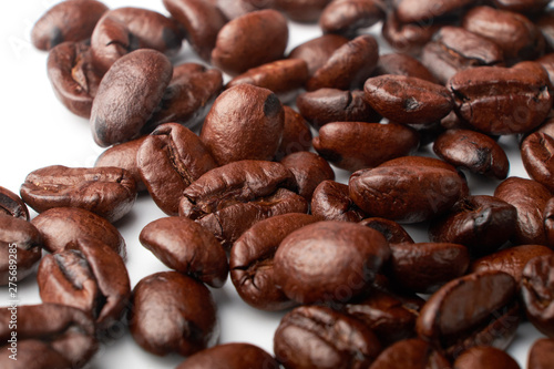 aromatic roasted coffee beans on white background
