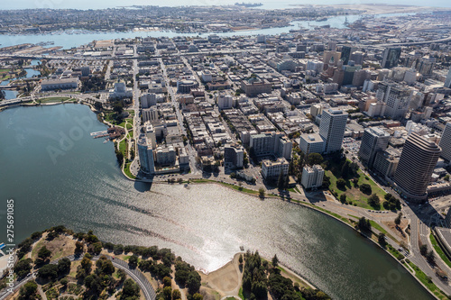 Aerial view of Lake Merritt and downtown Oakland buildings and streets in California.