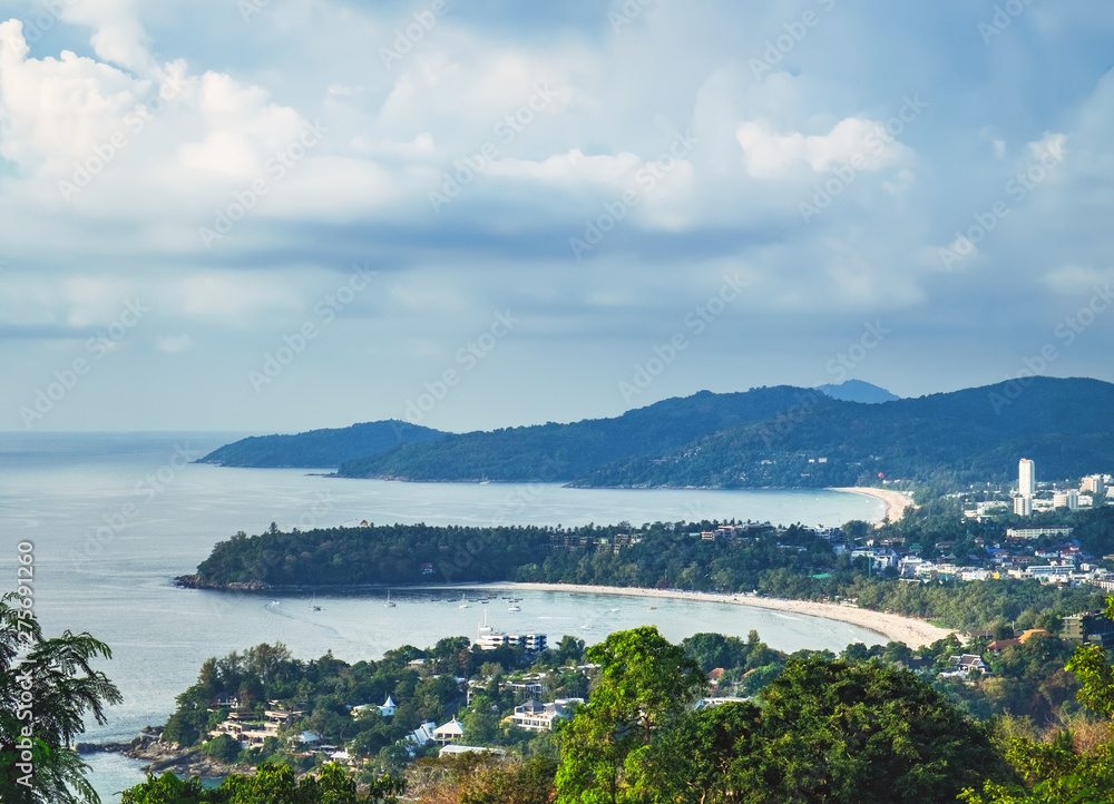 View of Kata Noi, Kata Yai and Karon Beaches from Karon Viewpoint. Famous Viewpoint in Phuket, Thailand. Picturesque top view to the tropical island with beach, blue sea, mountain, trees and resorts