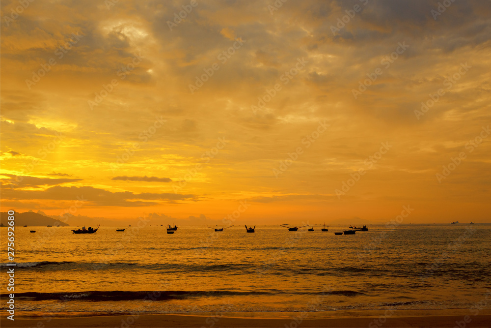 Sea view in the morning The sky is golden at the beach of Danang, Vietnam.