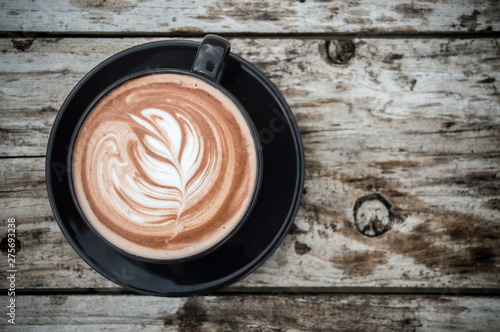 Served with hot coffee and coffee cup placed on a white background wood floors wood floors soft colors. Blurred space photo