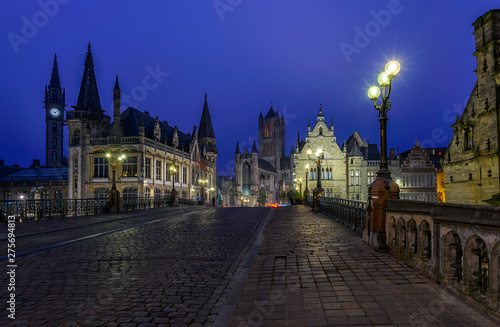 Medieval city of Gent (Ghent) in Flanders with Saint Nicholas Church and Gent Town Hall, Belgium. Nigth cityscape of Gent.