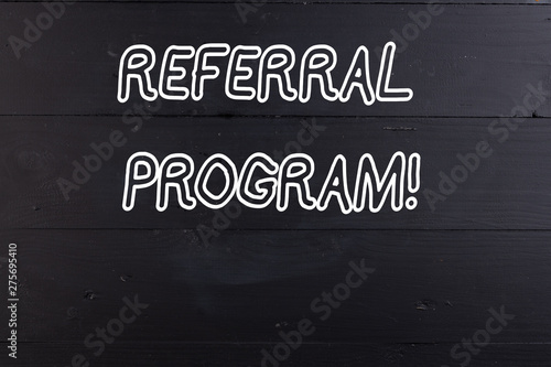 Word writing text Referral Program. Business photo showcasing internal recruitment method employed by organizations Wooden texture old vintage background horizontal boards holes. Old vintage