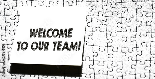 Word writing text Welcome To Our Team. Business photo showcasing introducing another demonstrating to your team mates Piece of square note paper use for give notation stick to puzzle background