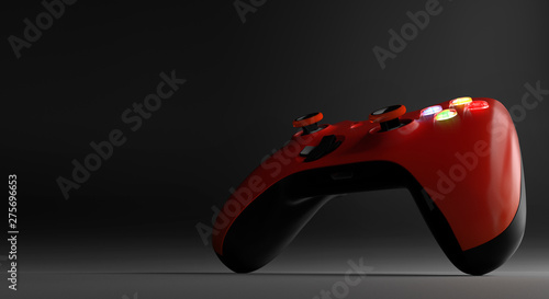 Red video game controller isolated on darkness background 