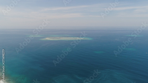 seascape aerial view coral reef  atoll with turquoise water in sea.Tropical atoll  coral reef in ocean waters. Travel concept.