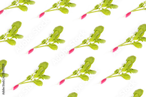 Fresh elongated radish on a white background. The concept of healthy food, healthy eating, growing vegetables, early harvest. Flat lay, minimalism, top view.