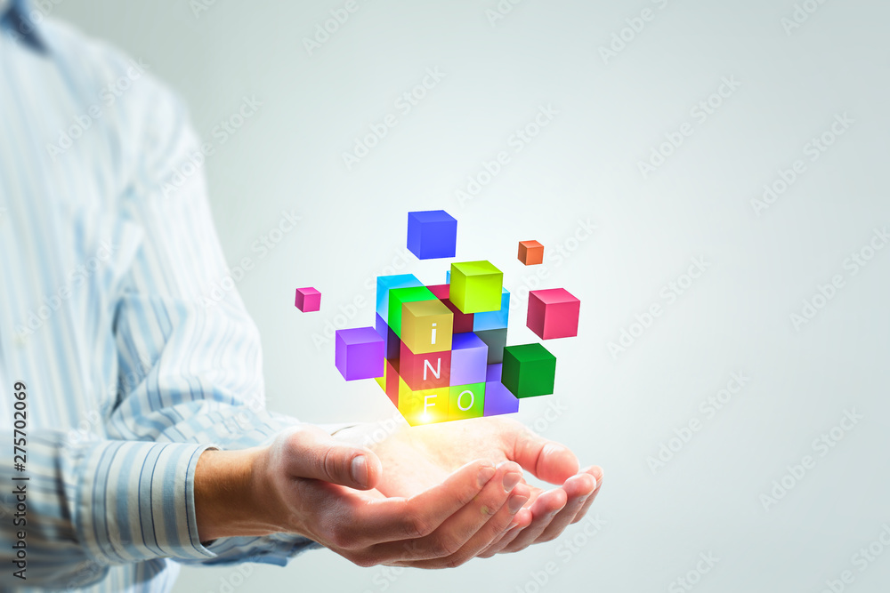 Man`s hand and cubes levitating above. Mixed media Man`s hand and cubes levitating above. Mixed media