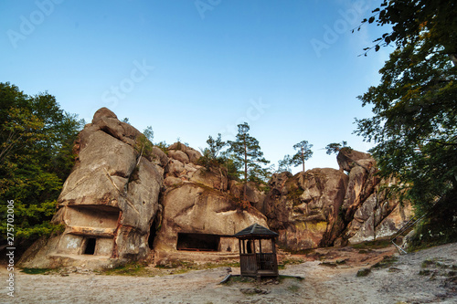 an ancient stone settlement. Unusual rock outcrops in nature reserve. Dovbush rocks, Ivano-Frankivsk region. Horizontal outdoors shot.Rocks and forest among the rocks. miracle of the world