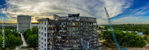 Aerial view of an office building under demolition by a wrecking ball in Columbia Town Center  Maryland new Washington DC  photo