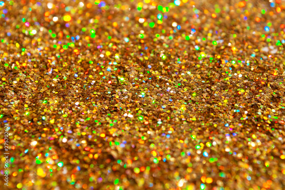 gold glitter is scattered. background. brilliance