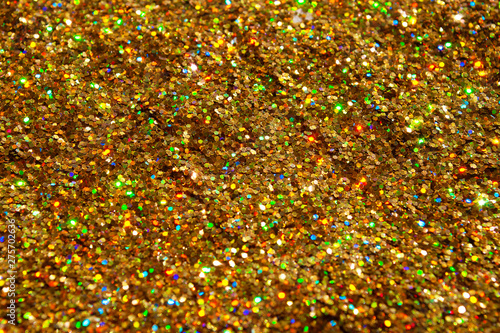 gold glitter is scattered. background. brilliance