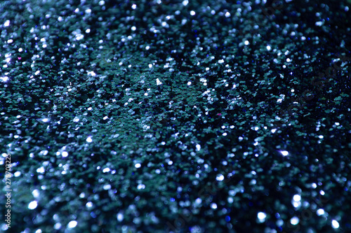 glitter scattered background. brilliance. close-up