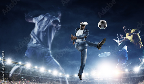 Virtual Reality headset on a black male playing soccer © Sergey Nivens