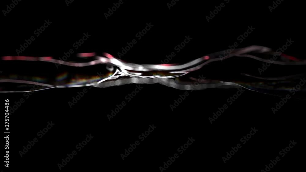 The swaying of the water surface close to the camera with a beautiful bokeh. Abstract surface wavers in space.