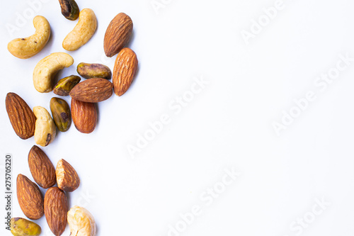 Almonds and nuts on white background