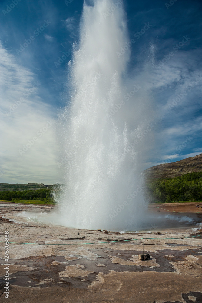 Iceland - Eruption of Strokkur geyser. Water and steam are ejected to a height of 30 meters