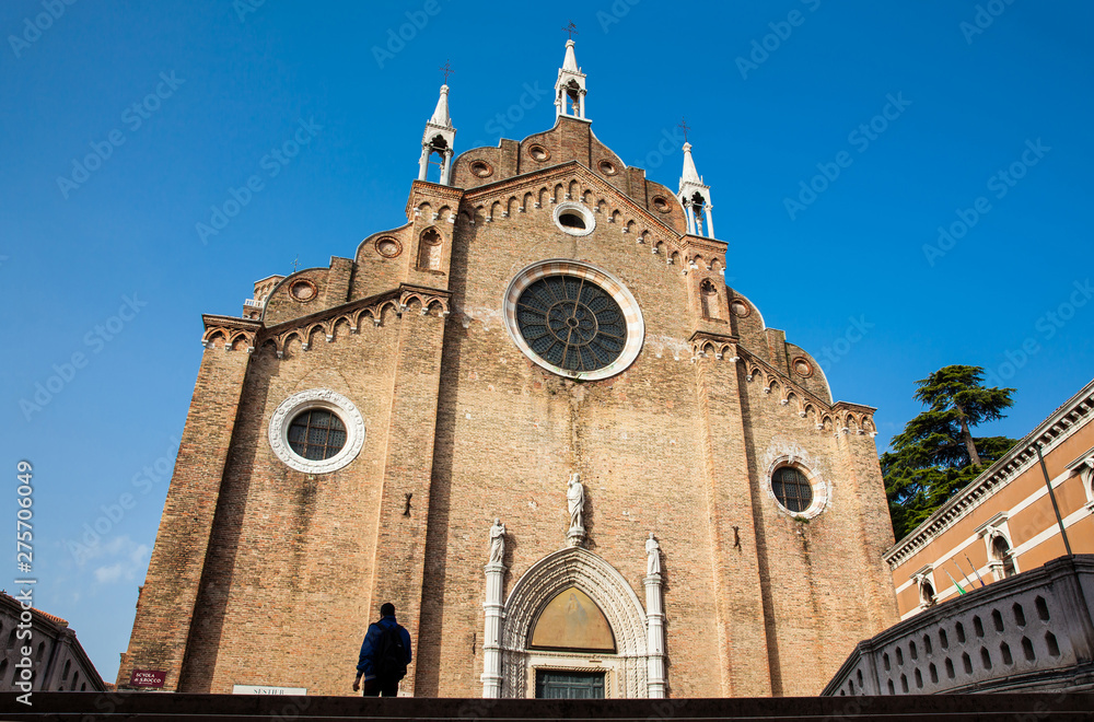 VENICE, ITALY - APRIL, 2018: Basilica di Santa Maria Gloriosa dei Frari located at the heart of the San Polo district of Venice and built between 1231 and 1440