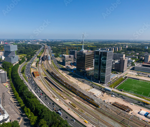 Aerial of highway and railway infrastructure connection between business district Zuidas and the Amsterdam Bijlmer Arena