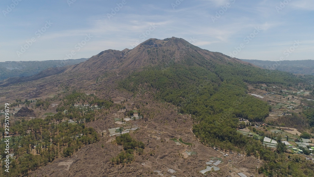 Aerial view volcano batur covered with vegetation mountain landscape with volcano sky and clouds Bali, Indonesia. Travel concept.