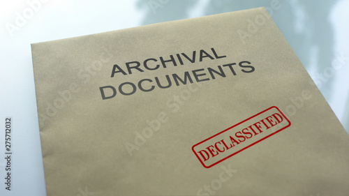 Archival documents declassified, seal stamped on folder with documents, close up photo